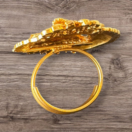 Gold Ring on a wooden surface