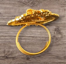 Gold Ring on a wooden surface