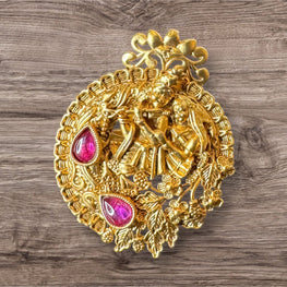Decorative gold Ring with pink gemstones on a wooden surface